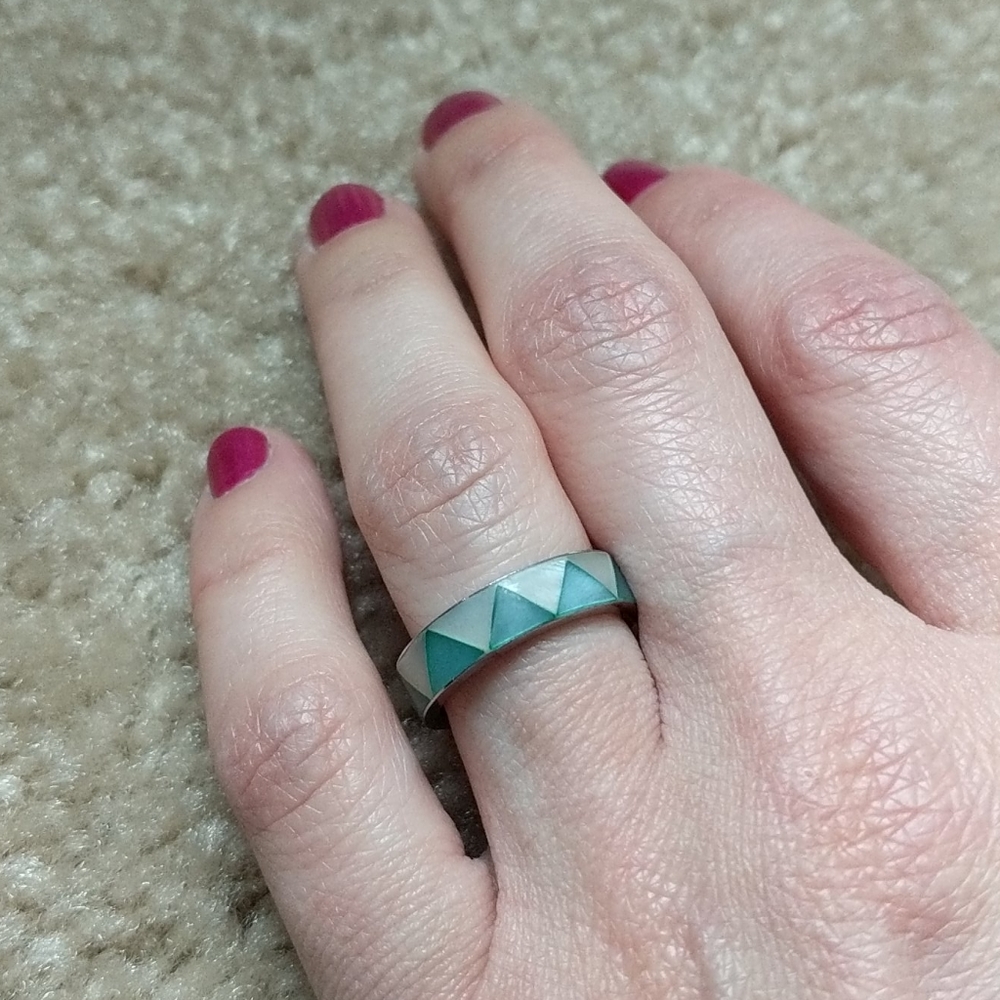 Silver ring inlaid with green and pearl triangles